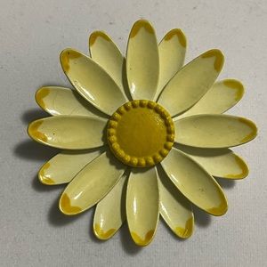 Vintage yellow metal flower brooch